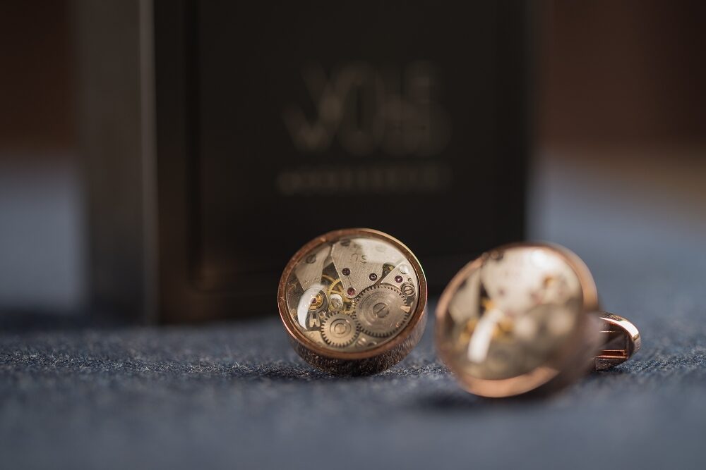 Round cufflinks with watch movements with lens