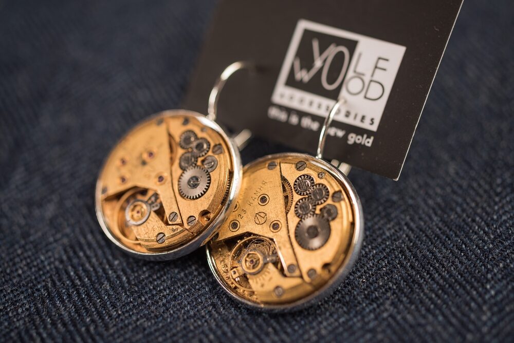 Earrings with gold plated watch movements