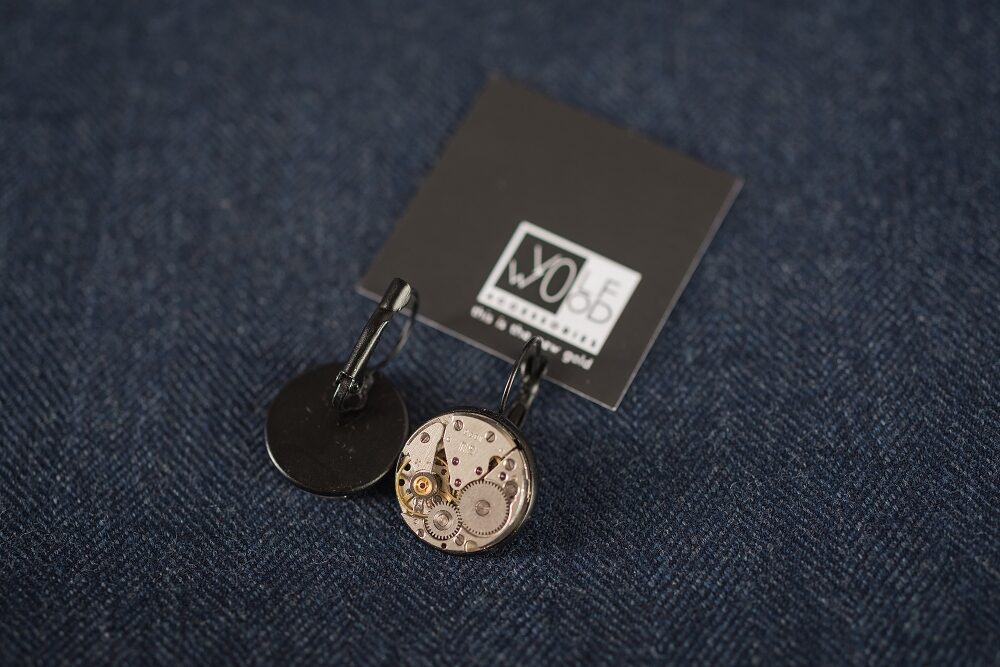 Earrings with watch movements in black frames
