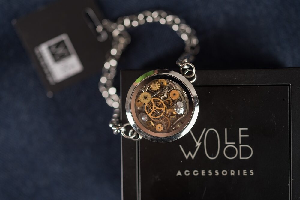 Glass bracelet with watch gears