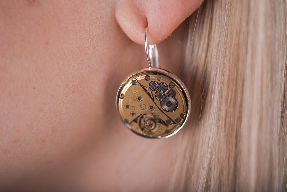 Earrings with gold plated watch movements