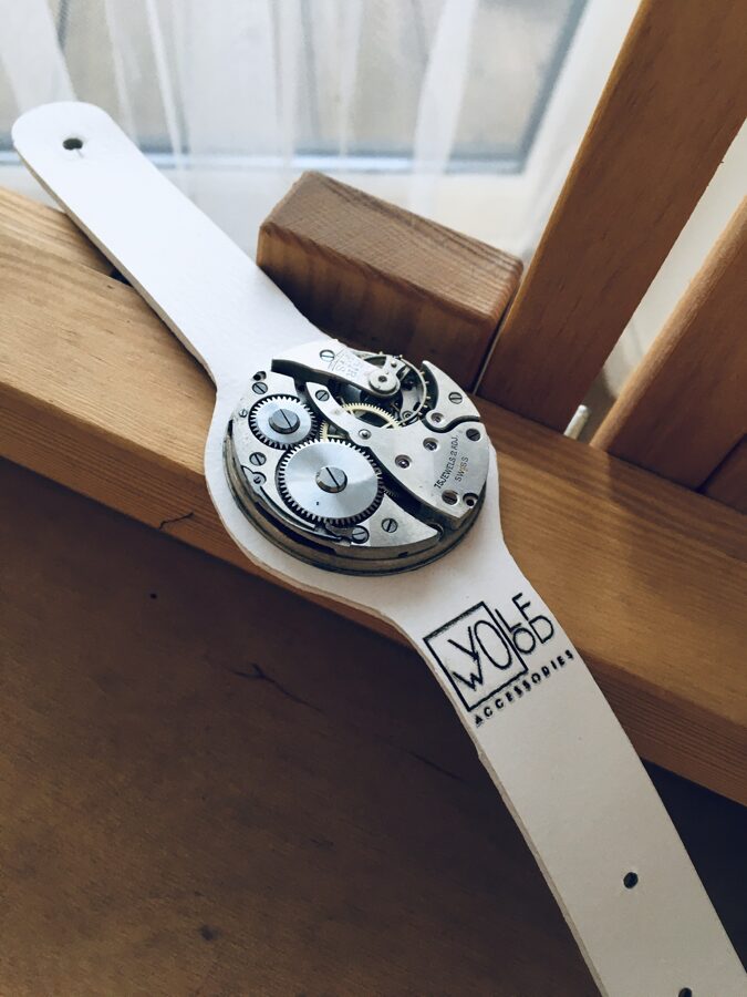 White leather bracelet with pocket watch movement