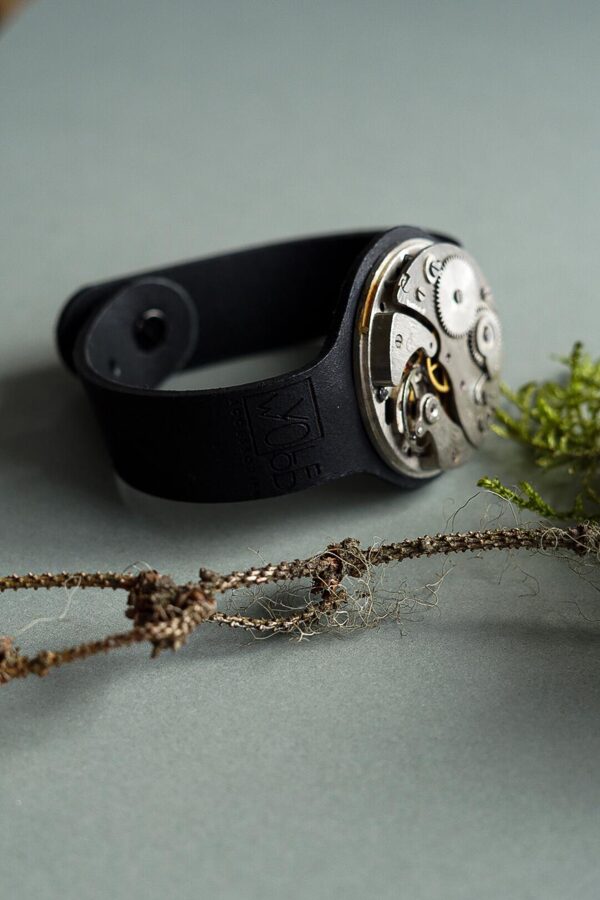 Black leather bracelet with pocket watch movement