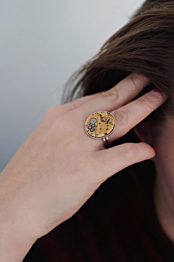 Ring with gold plated movement