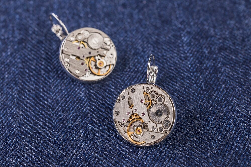 Earrings with watch movements in silver colour frames