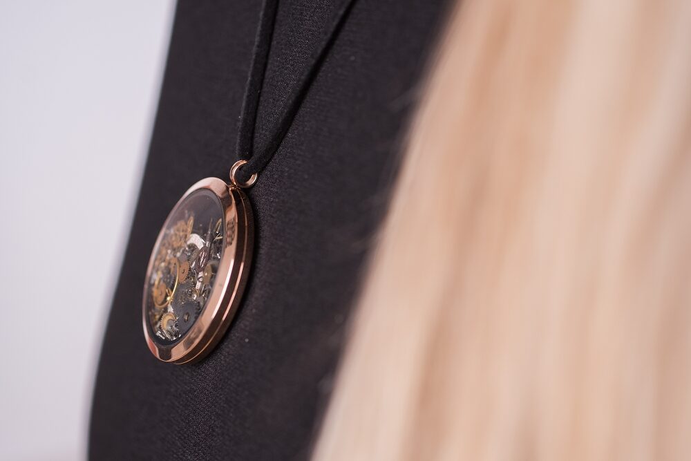 Rose gold necklace with movement gears