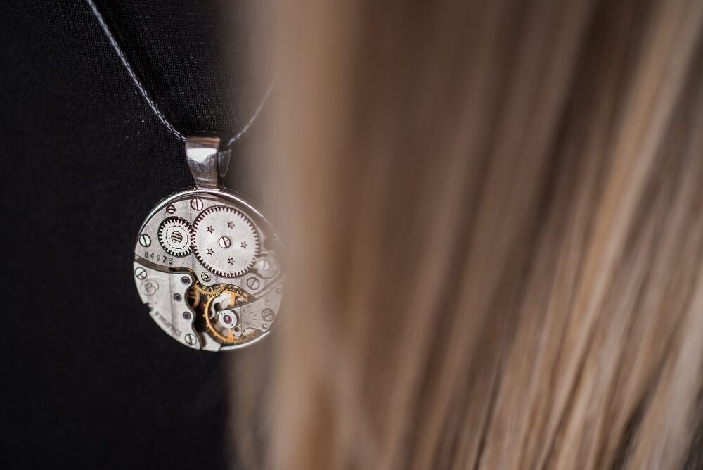 Necklace with watch movement 