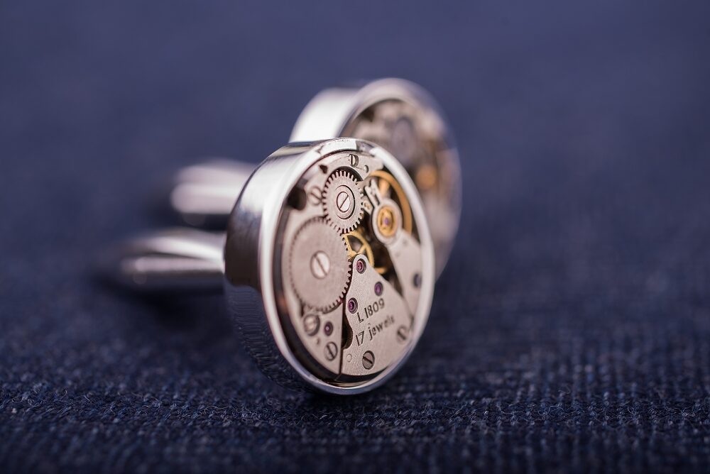 Round cufflinks with watch movements