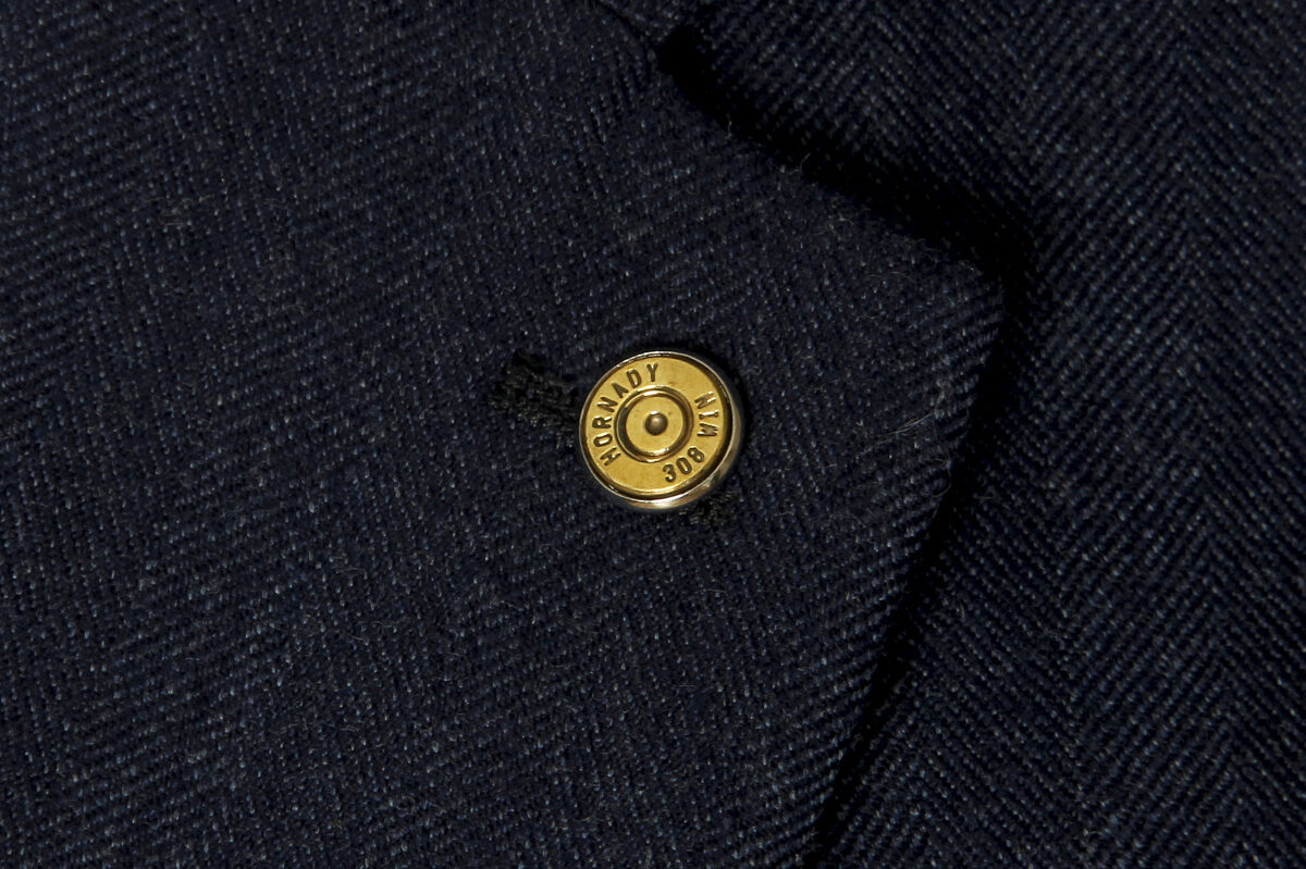 Pin with a bullet shell