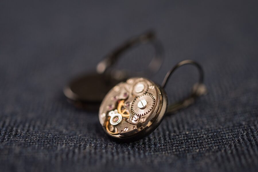 Earrings with watch movements in black frames